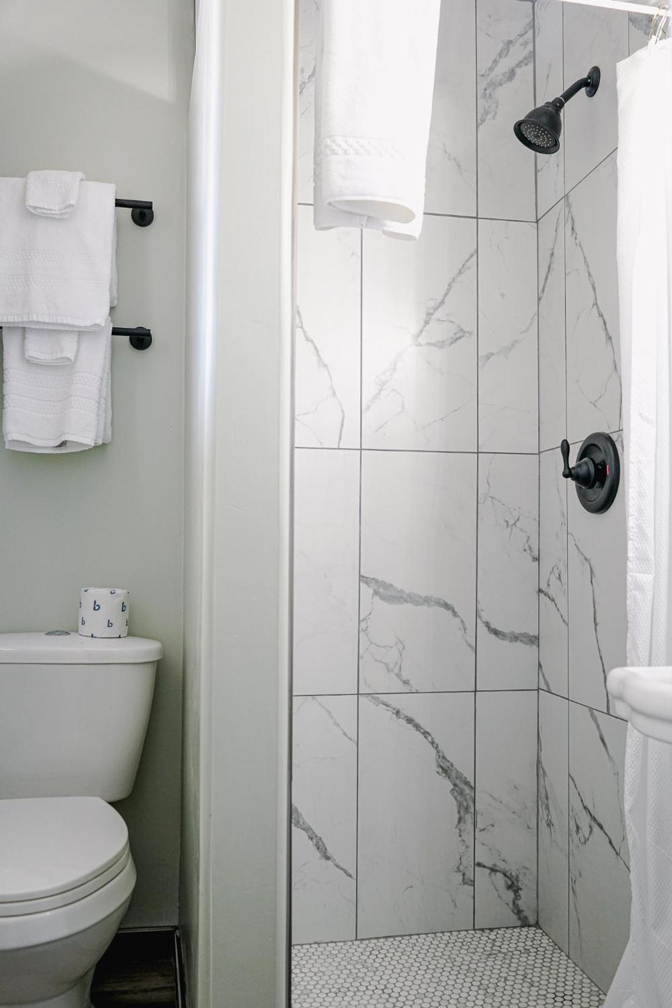 Sagebrush Inn Tombstone Room photo A shower with a shower door